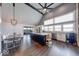 Open kitchen and dining area featuring an island, modern cabinets, and rustic ceiling beams at 260 17Th St, Columbus, IN 47201