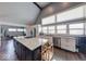 Well-lit kitchen with granite countertops, center island, and stainless steel appliances at 260 17Th St, Columbus, IN 47201