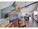 Inviting living space featuring rustic wood wall and staircase leading to the upper floor at 260 17Th St, Columbus, IN 47201