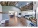 Spacious living room with open floor plan, lots of light, wood-planked ceiling and hardwood floors at 260 17Th St, Columbus, IN 47201
