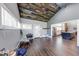 The living room has a vaulted ceiling, wood floors, and lots of light at 260 17Th St, Columbus, IN 47201