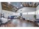 Bright living room boasts wood-planked vaulted ceilings, wood floors, and ample natural light at 260 17Th St, Columbus, IN 47201