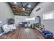 Open living room with wood-plank vaulted ceilings, wood floors and stylish decor at 260 17Th St, Columbus, IN 47201