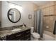 Bathroom featuring granite countertops, modern fixtures, and a shower with curtain at 2803 Wild Orchid Way, Columbus, IN 47201