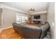 Inviting living room featuring tray ceilings, wood floors, and natural light at 2803 Wild Orchid Way, Columbus, IN 47201