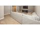 Large finished basement with sectional couch, built-in storage, and recessed lighting at 2803 Wild Orchid Way, Columbus, IN 47201