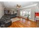 Open-concept living room with wood floors, plenty of light, and comfortable furniture at 2803 Wild Orchid Way, Columbus, IN 47201