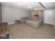 Spacious finished basement featuring a large sectional and a wet bar at 2803 Wild Orchid Way, Columbus, IN 47201