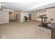 Spacious finished basement offers ample room for recreation and includes a kitchenette with white cabinetry at 2803 Wild Orchid Way, Columbus, IN 47201
