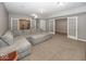 Finished basement with a large sectional couch and access to other rooms at 2803 Wild Orchid Way, Columbus, IN 47201