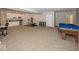 Finished basement includes kitchenette, pool table and workout area at 2803 Wild Orchid Way, Columbus, IN 47201