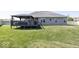 A beautiful backyard featuring a deck, gazebo, and expansive green space provides outdoor living and relaxation at 2803 Wild Orchid Way, Columbus, IN 47201