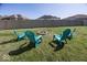 Spacious backyard with a fire pit and four Adirondack chairs at 2803 Wild Orchid Way, Columbus, IN 47201