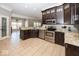 Kitchen features stainless steel appliances, custom cabinets, and granite countertops at 2803 Wild Orchid Way, Columbus, IN 47201