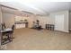 Versatile finished basement with exercise equipment, wet bar, and ample space at 2803 Wild Orchid Way, Columbus, IN 47201