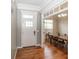 Inviting entryway features hardwood floors, white trim, and access to the dining room at 2803 Wild Orchid Way, Columbus, IN 47201