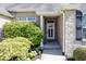 Inviting front entrance with stone accents and manicured landscaping at 2803 Wild Orchid Way, Columbus, IN 47201