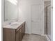 Bright bathroom with double sink vanity, large mirror, and separate shower at 288 Commodore Dr, Pittsboro, IN 46167