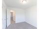 This bedroom has neutral carpet and walls, awaiting your personal touch to transform it into your ideal retreat at 288 Commodore Dr, Pittsboro, IN 46167