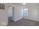 Clean bedroom with neutral carpet and ample natural light from the window at 288 Commodore Dr, Pittsboro, IN 46167