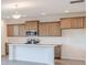 Well-lit kitchen boasts a spacious island, modern cabinets, and stainless steel appliances at 288 Commodore Dr, Pittsboro, IN 46167