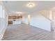 Spacious living room with an open floor plan and kitchen with modern island at 288 Commodore Dr, Pittsboro, IN 46167