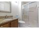 Updated bathroom with granite counters, oak cabinets, and tub shower combo at 3114 Village Park N Dr, Carmel, IN 46033