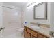 Bathroom featuring a bathtub, vanity, and a large mirror that enhances the space at 3114 Village Park N Dr, Carmel, IN 46033