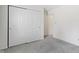 Bedroom with gray carpet, closet with sliding doors, and white trim for a clean aesthetic at 3114 Village Park N Dr, Carmel, IN 46033