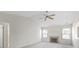 Spacious bedroom with vaulted ceiling, fireplace, fan, and bright natural light from multiple windows at 3114 Village Park N Dr, Carmel, IN 46033