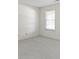 A bedroom showing a neutral color palette with natural light coming in from the window at 3114 Village Park N Dr, Carmel, IN 46033