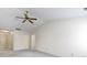 Neutral living room features vaulted ceiling, ceiling fan, neutral walls and carpet at 3114 Village Park N Dr, Carmel, IN 46033