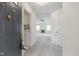 Inviting foyer opens to a bright, carpeted living space with views of a fireplace and abundant natural light at 3114 Village Park N Dr, Carmel, IN 46033
