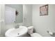 Powder room with modern vanity, large mirror, decorative accessories, and framed wall art at 3286 Hemlock St, Whiteland, IN 46184