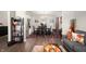 Open-concept dining room featuring modern decor, hardwood flooring and lots of natural light at 3286 Hemlock St, Whiteland, IN 46184