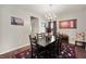 Spacious dining area features hardwood floors, modern lighting, and stylish decor at 3286 Hemlock St, Whiteland, IN 46184