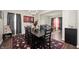 Cozy dining room with elegant lighting, hardwood floors and contemporary furnishings at 3286 Hemlock St, Whiteland, IN 46184