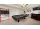 A finished basement with a pool table and bar area, perfect for entertainment at 3286 Hemlock St, Whiteland, IN 46184