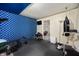 Home gym with workout equipment, blue accent wall, and open space for exercising at 3286 Hemlock St, Whiteland, IN 46184