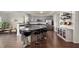 A spacious kitchen with stainless steel appliances and a large island with seating at 3286 Hemlock St, Whiteland, IN 46184