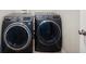 Modern laundry room features a gray, front-loading washer and dryer set at 3286 Hemlock St, Whiteland, IN 46184