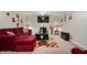 Living room with comfortable seating, media console, and soft carpet providing an inviting atmosphere at 3286 Hemlock St, Whiteland, IN 46184