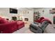 Cozy living room with comfortable seating and fireplace, perfect for relaxing or entertaining guests at 3286 Hemlock St, Whiteland, IN 46184