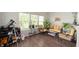 Bright sunroom featuring wicker furniture, plants, and a view of the outdoors at 3286 Hemlock St, Whiteland, IN 46184