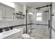 Modern bathroom featuring a glass enclosed shower and marble countertop sink at 360 Hope Ct, Greenwood, IN 46142
