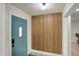 Inviting entryway with a blue door, decorative wood wall, and modern finishes create a stylish welcome at 360 Hope Ct, Greenwood, IN 46142