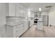 Modern kitchen with white cabinets, subway tile backsplash, and stainless steel appliances at 360 Hope Ct, Greenwood, IN 46142