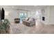 Bright and airy living room with fireplace, hardwood floors, and sliding glass doors at 360 Hope Ct, Greenwood, IN 46142