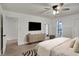 Spacious main bedroom with wood floors, stylish decor, and a ceiling fan at 360 Hope Ct, Greenwood, IN 46142