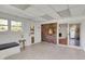 Relaxing sunroom with brick accent wall, guitar decor, and access to the backyard at 360 Hope Ct, Greenwood, IN 46142
